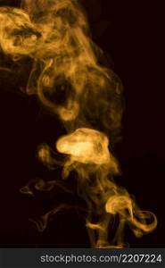 abstract yellow transparent smoke fumes black background
