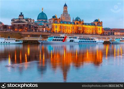 Academy of Fine Arts, tourist ships and Bruehl&amp;#39;s Terrace aka The Balcony of Europe with reflections in the river Elbe at night in Dresden, Saxony, Germany