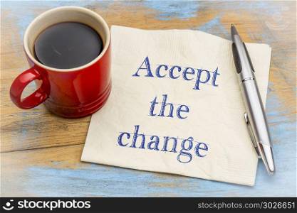 Accept the change - advice on napkin. Accept the change - inspirational handwriting on a napkin with cup of coffee