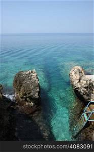 Access to the sea between sharp rocks,Adriatic sea,Montenegro