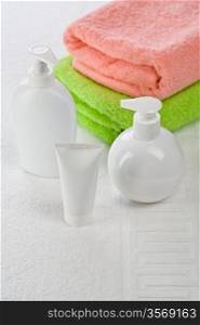 Accessories for bathing on white towel