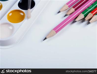 Accessories for painting. Brushes and pencils. Pencils and watercolors. back to school