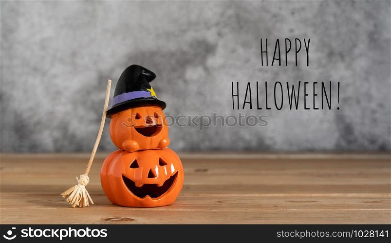 Accessories of decorations Happy Halloween day background concept.Couple jack O Lanterns with spooky pumpkins object and witch broom to party season on modern brown & white stone backdrop.text detail