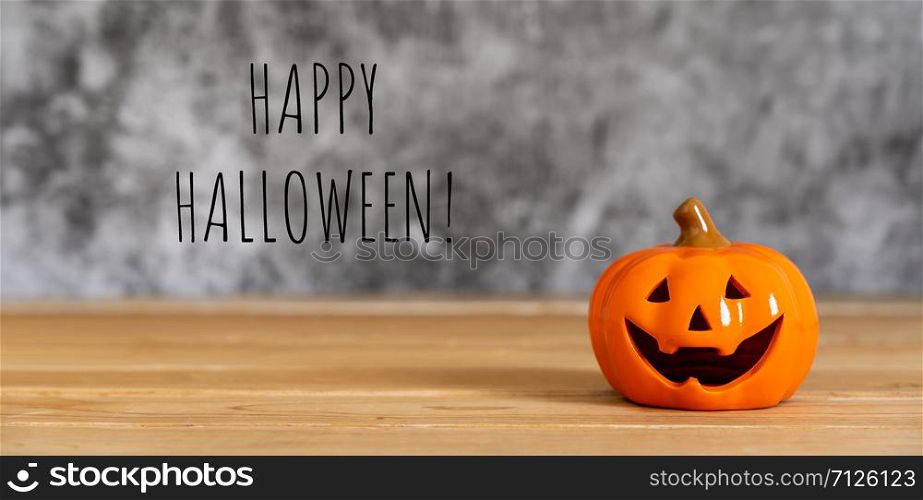 Accessories of decorations Happy Halloween day background concept.Jack O Lanterns with spooky pumpkins object to party season on modern brown & white stone backdrop.creative text welcome of season.