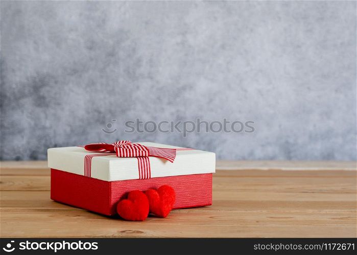 Accessories of decorations valentine&rsquo;s day background concept.Essential items colorful pastel love shape with gift box on modern rustic brown wooden & grey cement.blank space for mock up design.