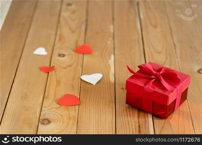 Accessories of decorations valentine&rsquo;s day background concept.Essential items colorful love shape with gift box on modern rustic brown wooden & grey cement.blank space for mock up design text.