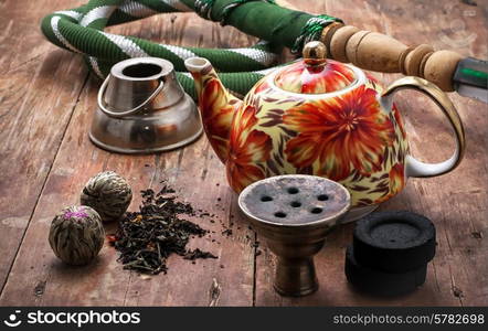 accessories to smoking hookah and dry tea leaves.