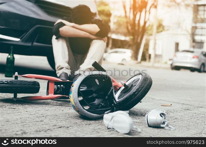 Accident that occurred man who drank alcohol and drunk stress with crash child bike on the ground.