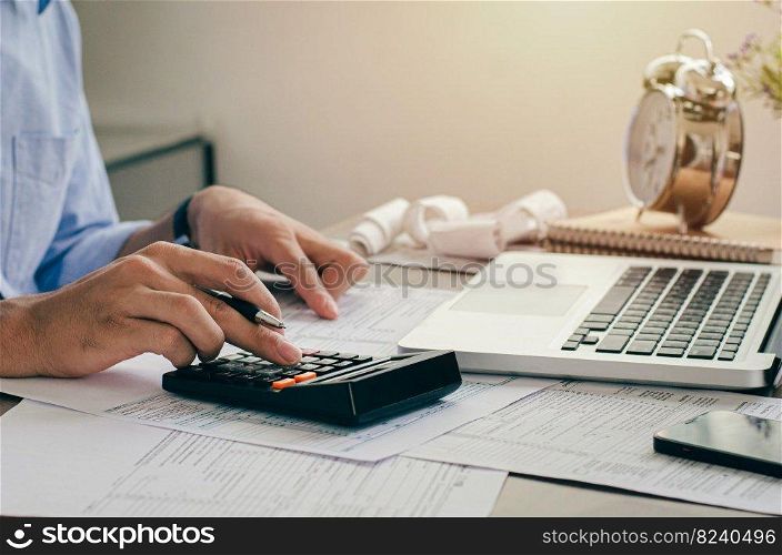 Accountant, business man or banker who is doing calculations. in the financial concept of business finance, accounting, banking, tax