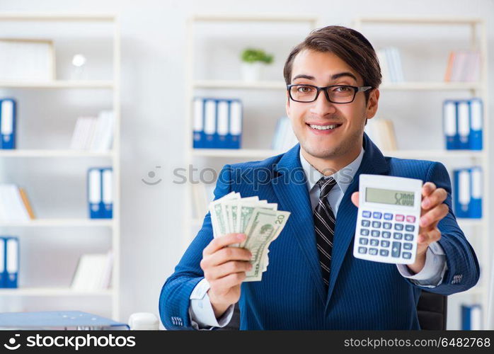 Accountant calculating dollars with calculator in office