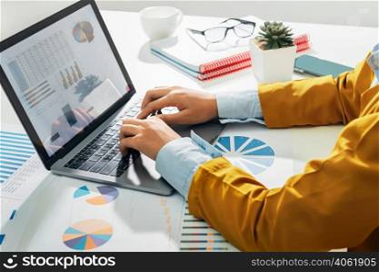 accountant using laptop computer on desk in office. business accounting concept