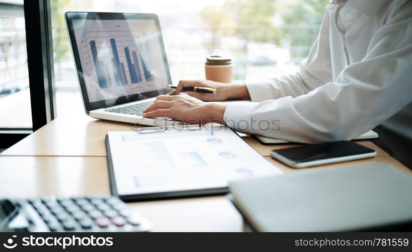 Accountant working with data documents calculating on business report.