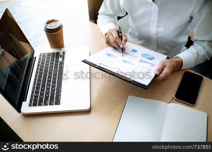 Accountant working with data documents calculating on business report, Selective focus.