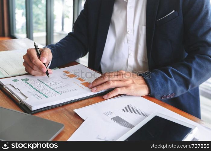 Accountant working with data documents calculating on business report, Selective focus.