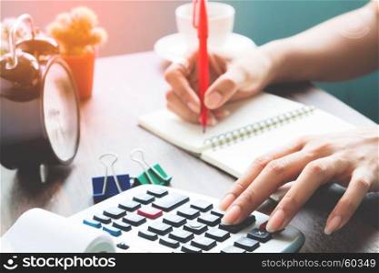 Accounting concept, Working woman using calculator