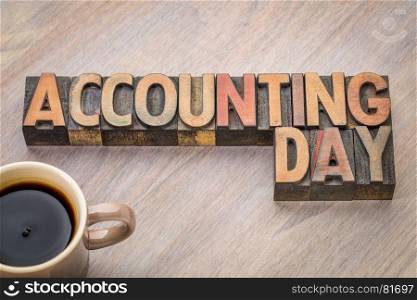 Accounting Day - word abstract in vintage letterpress wood type with a cup of coffee