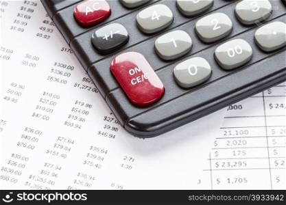 Accounting in process with calculator and financial charts