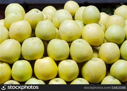 accumulated green apples in a store of fruits