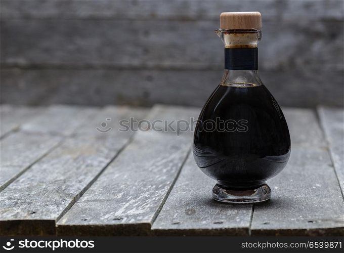 Aceto balsamico on old gray wood.. Aceto balsamico on old gray wood