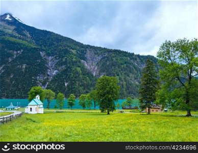 Achensee ( Lake Achen) summer landscape and church on blossoming meadow (Austria).