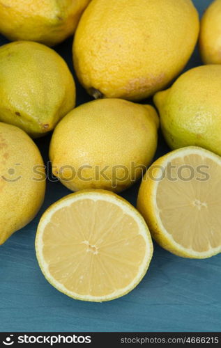 Acid and yellow fruit. Lemons on a blue wood