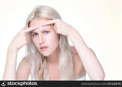 Acne problem troubling personable worried woman with natural beauty skin checking her face squeezing pimple spots in isolated background. Copyspace for blemish skincare treatment problem.. Acne problem troubling personable worried woman with natural beauty skin.