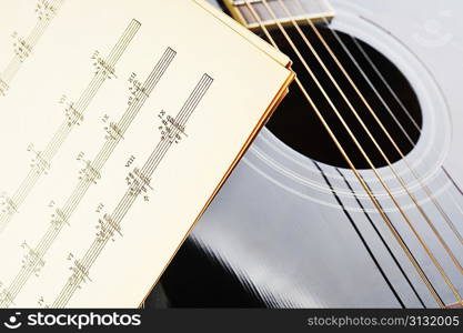 acoustic guitar and sheet music
