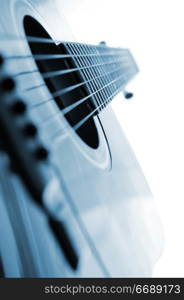 Acoustic guitar close up on white background