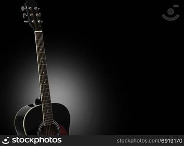 Acoustic guitar isolated on a black background. With clipping path