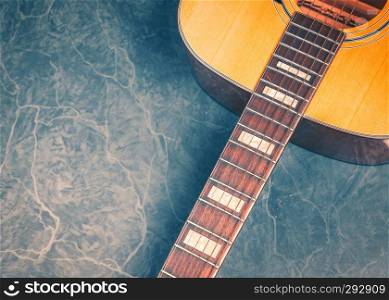 acoustic guitar on green marble background,music concept.
