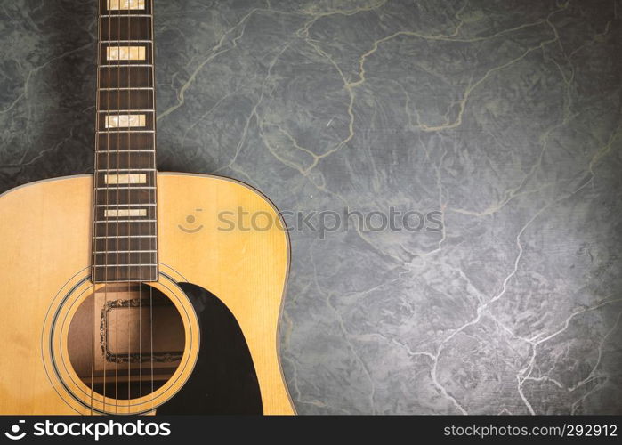 acoustic guitar on green marble background,music concept.