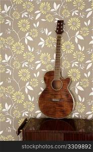acoustic guitar retro on vintage 60s wallpaper wooden furniture