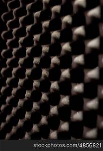acoustic materials, texture and soundproofing concept - foam rubber surface at sound recording studio