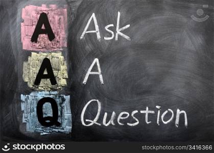 Acronym of AAQ for Ask a Question written in chalk on a blackboard
