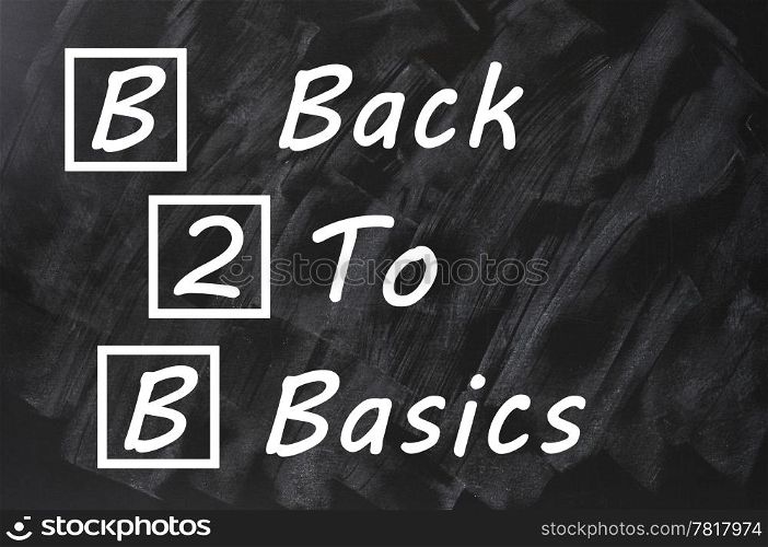 Acronym of B2B for Back to basics written on a smudged blackboard