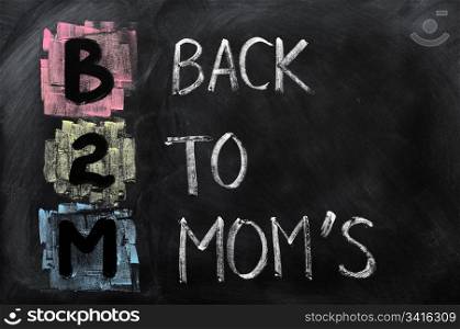 Acronym of B2M - Back to Mom&rsquo;s written on a blackboard