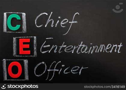 Acronym of CEO - Chief Entertainment Officer written in chalk on a blackoard