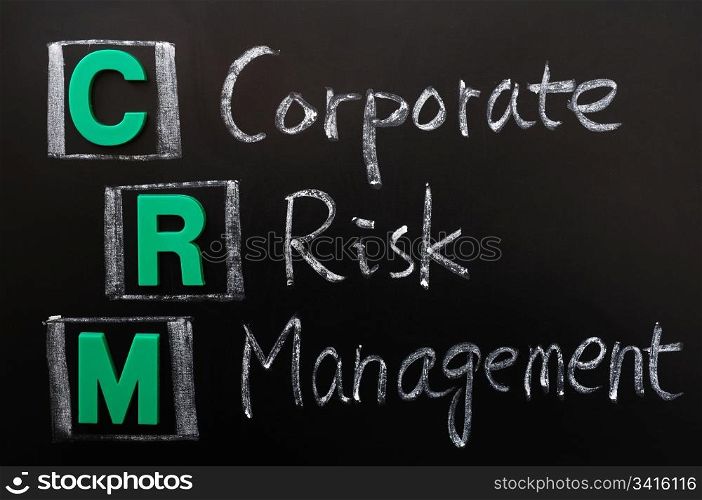 Acronym of CRM - Corporate Risk Management written on a blackboard