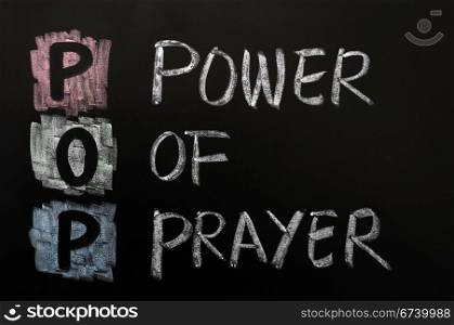 Acronym of POP - Power of prayer written on a blackboard