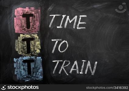Acronym of TTT for Time To Train written on a blackboard