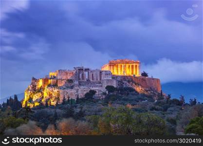 Acropolis Hill and Parthenon in Athens, Greece. Aerial view of the Acropolis Hill, crowned with Parthenon during evening blue hour in Athens, Greece
