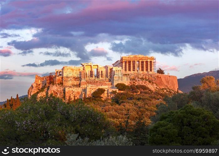 Acropolis Hill and Parthenon in Athens, Greece. Aerial view of the Acropolis Hill, crowned with Parthenon at sunset in Athens, Greece
