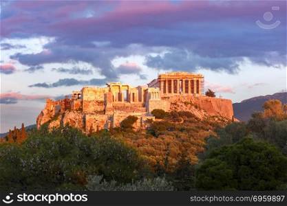 Acropolis Hill and Parthenon in Athens, Greece. Aerial view of the Acropolis Hill, crowned with Parthenon at sunset in Athens, Greece