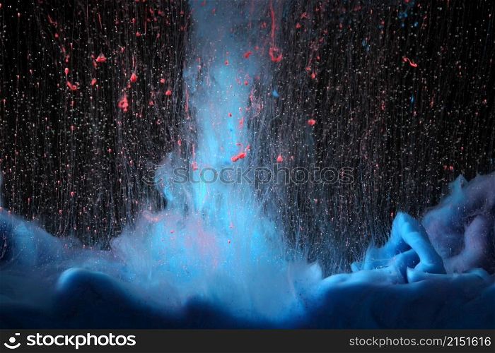 Acrylic blue and red colors bang splash in water. Ink blot. Abstract horizontal background.