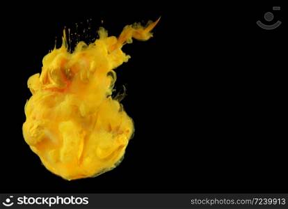 Acrylic yellow colors in water. Ink blot. Abstract background.
