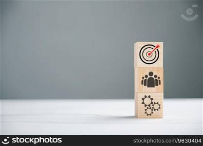 Action Plan, Goal, and Target icons on a wooden cube block step. Success and business target concept. Project management and company strategy symbolize progress.