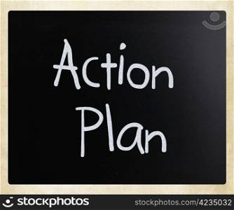 ""Action Plan" handwritten with white chalk on a blackboard."