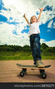 Active childhood. Little man skateboarding. Skater boy child kid with his skateboard. Outdoor.