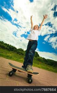 Active childhood. Little man skateboarding. Skater boy child kid with his skateboard. Outdoor.