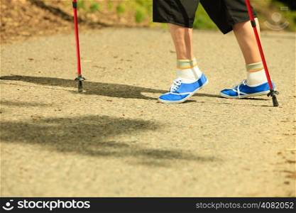 active mature lifestyle. senior nordic walking in a countryside park